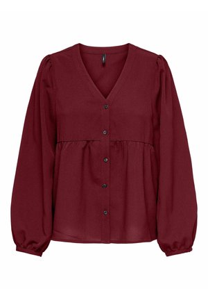 Bordeaux bluse i let stof med V-hals, knaplukning foran og samlet talje. Har lange, puffede ærmer og en glat tekstur.