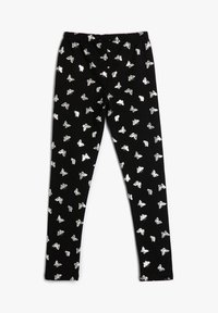 Leggings negros con patrón de mariposas plateadas y cinturilla elástica, extendidos sobre un fondo blanco.