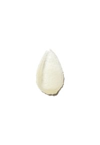 Applicatore in silicone bianco a forma di goccia, spugnoso, con una superficie morbida e testurizzata e una cavità interna liscia, progettato per l'uso cosmetico.