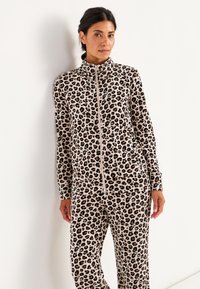 Lopende set met luipaardprint, gemaakt van een zachte stof. Inclusief een ritsjack en bijpassende broek, met lange mouwen en een aansluitend ontwerp.