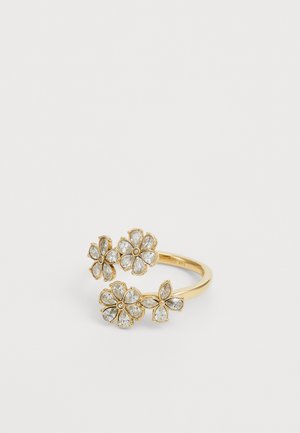 Gold-tone ring featuring three floral designs, adorned with clear, teardrop-shaped gemstones, with small round accents in the center.