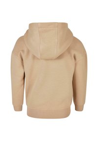 Sudadera de algodón beige con tejido texturizado, capucha con cordón y puños y dobladillo acanalados. La vista trasera muestra un diseño sin costuras.