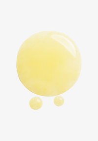 Translucent yellow gel in a round shape, accompanied by two smaller droplets; smooth surface with a glossy finish.