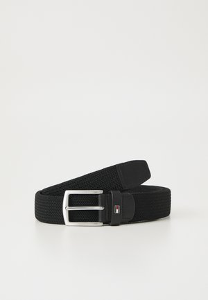 Black elastic woven belt with a silver metal buckle and a leather accent. Features a logo detail on the leather portion.
