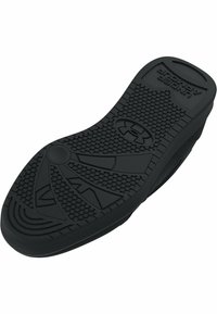 Semelle intérieure en caoutchouc noir avec une surface texturée présentant des motifs circulaires et angulaires, remarquée pour son design flexible et son amortissement.