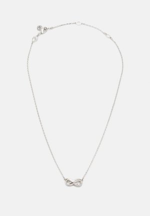 Collier en argent délicat avec une chaîne fine et un pendentif petit symbole infini orné de minuscules pierres transparentes.