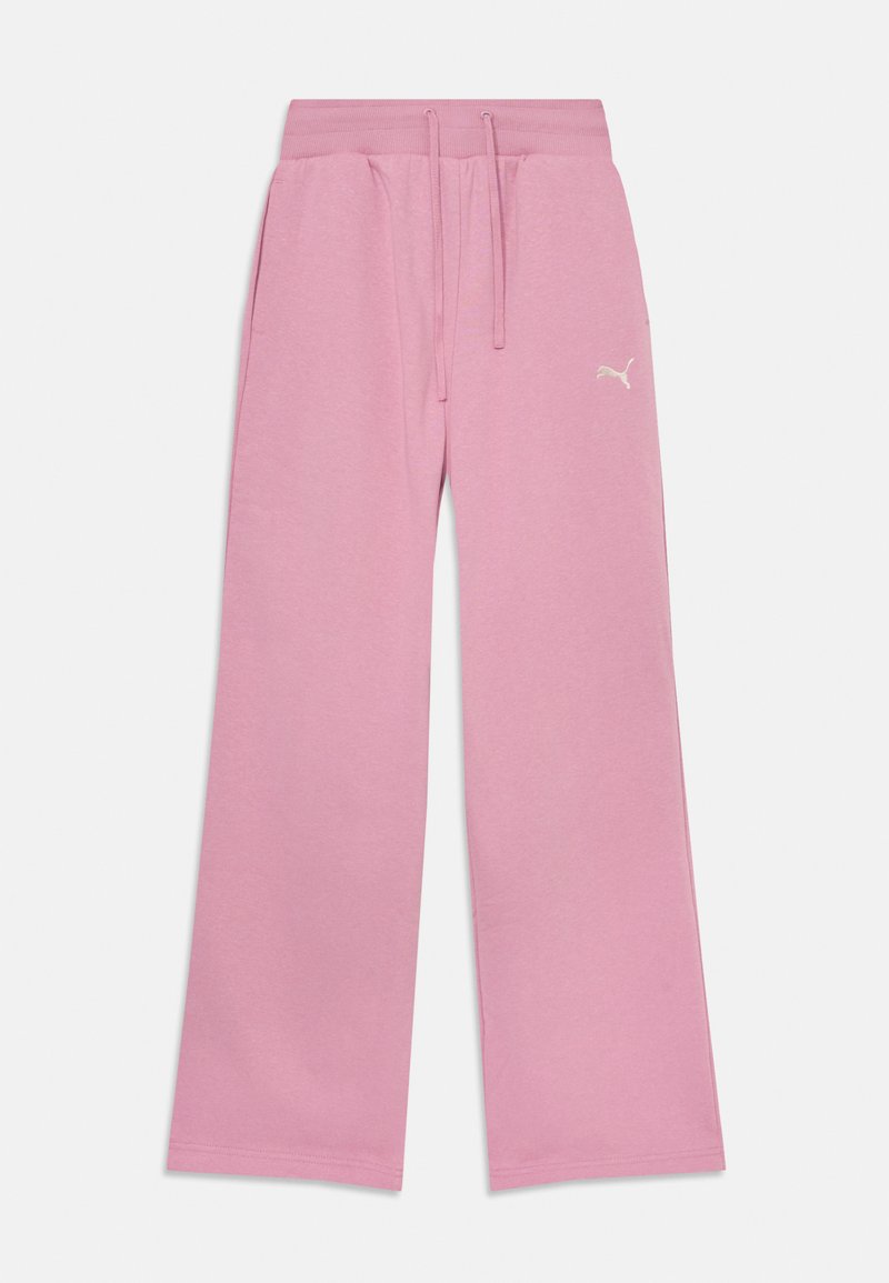 Roze trenirke širokega kroja, izdelane iz mehke tkanine. Imajo elastičen pas in vrvico, ter majhen logotip.