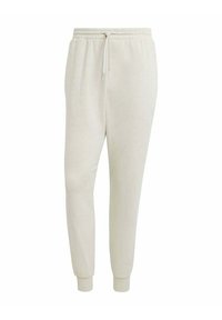 Pantaloni tuta color beige chiaro realizzati in un tessuto morbido, dotati di una vita elasticizzata con cordino, gambe affusolate e polsini in costina.