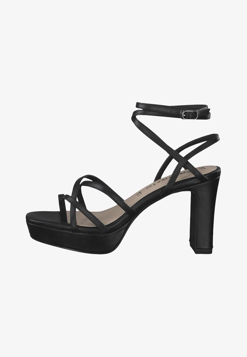 Sandales à talons hauts noires avec plateforme, comportant plusieurs brides croisées et une boucle à la cheville. Matériau lisse et design à talon bloc.