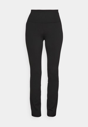 Leggings noirs extensibles avec une taille haute, texture lisse, design ajusté et style minimaliste, adaptés pour le sport ou un usage décontracté.