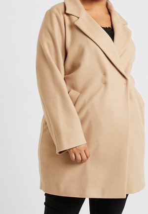 Beżowy płaszcz z mieszanki wełny z kołnierzem z wycięciem, jednorzędowym zapięciem na guziki i bocznymi kieszeniami, charakteryzujący się miękką fakturą i luźnym krojem.