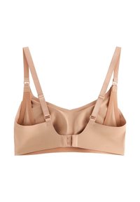 Μπεζ ασύρματος στηθόδεσμος με ρυθμιζόμενους ιμάντες, λείο ύφασμα και κλείσιμο πίσω με τρία γάντζους. Διαθέτει απλό, αδιάκοπο σχέδιο.