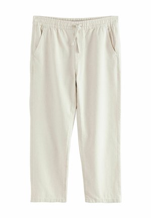 Beżowe, casualowe spodnie z elastycznym paskiem, sznurkiem do wiązania, bocznymi kieszeniami i prostym krojem nogawek.