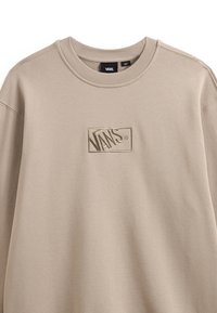 Beige sweatshirt made of soft fabric with a round neckline. Features an embroidered Vans logo in the center. Simple, casual design.