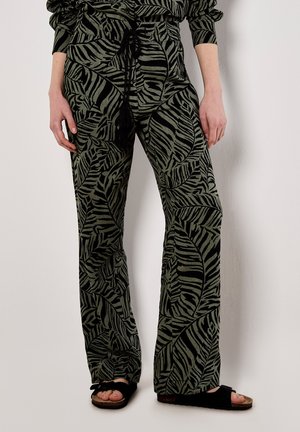 Green patterned trousers with a leaf design, elastic waistband featuring a drawstring, and wide-leg silhouette. Textured fabric with slight sheen.