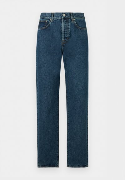 Σκούρα μπλε τζιν με ίσια γραμμή, κλείσιμο μπροστά με κουμπί και φερμουάρ, θηλιές για ζώνη, μπροστινές τσέπες και ραφές σε αντίθεση.