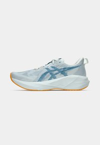 Lightweight athletic shoe in light gray mesh with blue accents. Features a textured white midsole and orange rubber outsole. Minimalist design.