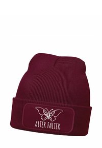 Maroon knitted beanie with a folded cuff. Features a rectangular patch with a white butterfly design and "ALTER FALTER" text.