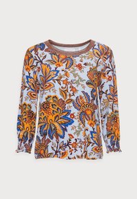 Blouse à manches longues avec un motif floral multicolore en bleu, orange et marron sur un fond clair ; encolure ronde avec un bord pailleté.