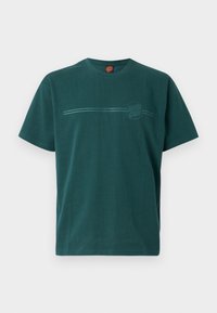 Tyrkise bomull T-skjorte med rund hals, korte ermer, en horisontal linje og sirkulært logo-design i lys grønn. Enkel, avslappet passform.