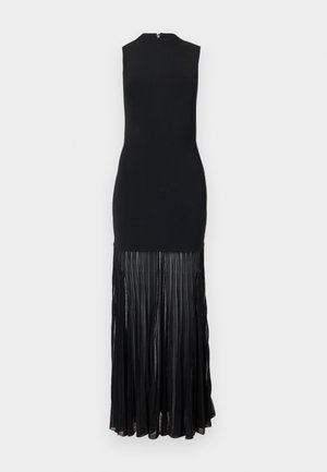 Robe maxi noire sans manches avec un col montant et une jupe plissée transparente s'étendant du milieu de la cuisse jusqu'à l'ourlet.