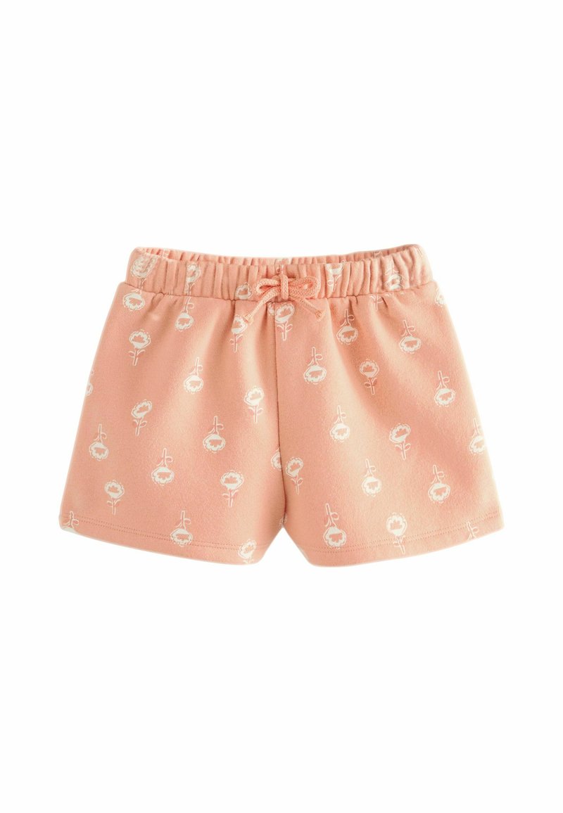 Persikofärgade bomullsshorts med elastisk midja och dragsko, med vita blommönster. Slät textur och avslappnad design.