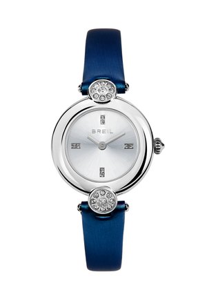 Montre Breil ronde en argent avec un bracelet bleu, des marqueurs en cristal aux positions 12, 3, 6 et 9, et des accents décoratifs en cristal au-dessus et en dessous du cadran.