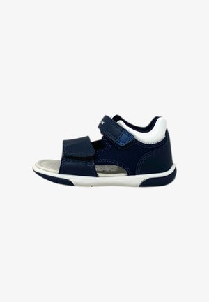 Sandali per bambini di colore blu navy con due cinturini in Velcro regolabili, dettagli bianchi, design traspirante e suole in gomma testurizzata.