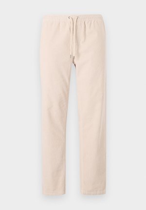 Pantaloni beige chiaro realizzati in tessuto morbido, con una vita elastica dotata di cordoncino e gambe dritte. Texture liscia, senza motivi.