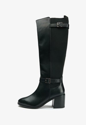 Black knee-high boots featuring glossy leather and textured fabric panels, a buckle accent, and a chunky block heel.