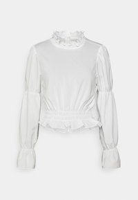 Blouse blanche à manches longues bouffantes et col montant froncé. Taille cintrée et ourlet à volants. Tissu lisse et léger.