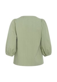 Ljusgrön blus med vertikala ränder, rund halsringning och puffärmar. Gjord av mjukt tyg, med elastiska manschetter för en avslappnad passform.
