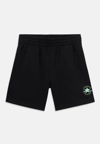 Pantalones cortos de algodón negros con cintura elástica, que presentan un logo verde y blanco de Converse All Star en el lado inferior derecho.