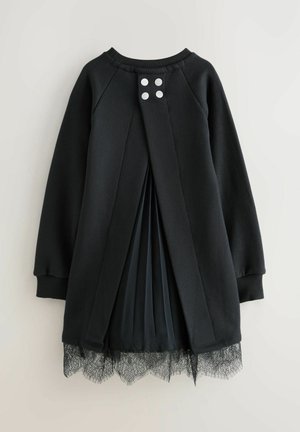Black sweatshirt dress featuring a rounded neckline, silver button accents, pleated skirt, and lace trim at the hem. Soft fabric, relaxed fit.