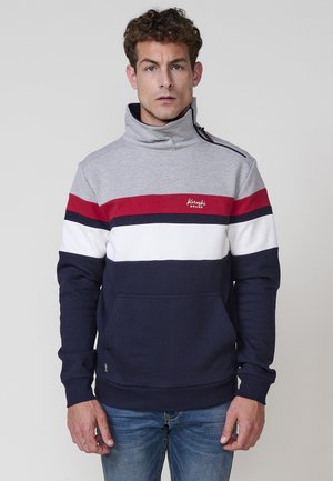 Pullover de rayas múltiples para hombre en gris, rojo, blanco y azul marino, con cuello alto, detalle de cremallera y bolsillo frontal. Material mezcla de algodón.