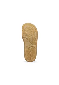 Semelle de chaussure en caoutchouc avec un design texturé en motifs ondulés de couleur beige. Présente un bord arrondi et un logo sur le dessous.