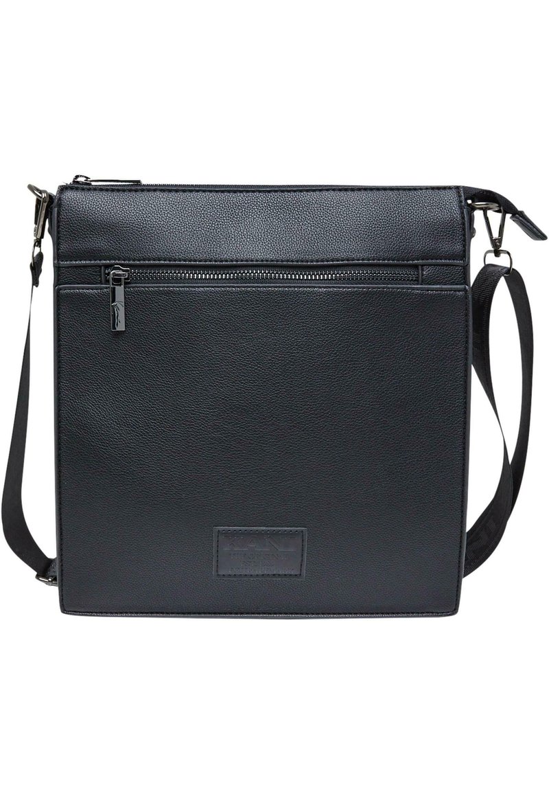 Crna kožna torba za poruke s teksturiranim završetkom, s gornjim patentnim zatvaračem i prednjim džepom s patentnim zatvaračem. Podesiva naramenica.