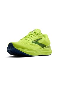 Scarpe da corsa verde lime con tomaia in rete traspirante, suola blu e dettagli riflettenti. Presentano un'intersuola ammortizzata e dettagli perforati.