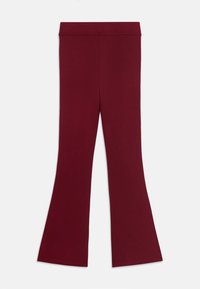 Burgundi színű, bővülő leggings rugalmas anyagból; sima felület és rugalmas derékpánt jellemzi a kényelmes és könnyű viselet érdekében.
