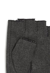 Fingerless gloves in dark grey denim with a textured finish. Features exposed seams and an open section for the fingertips.