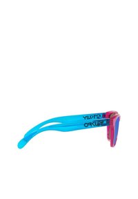 Blue and pink sunglasses with a transparent frame, featuring straight arms and distinct branding on the sides. Reflective lenses.
