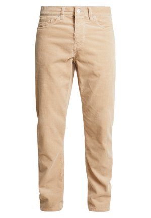 Beige corduroy pants with vertical ribbing, five-pocket design, metal button closure, and straight-leg cut. Soft texture, casual style.