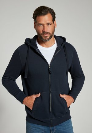 Navy zip-up hoodie made from cotton blend fabric, featuring a drawstring hood, front pockets, and ribbed cuffs and hem.
