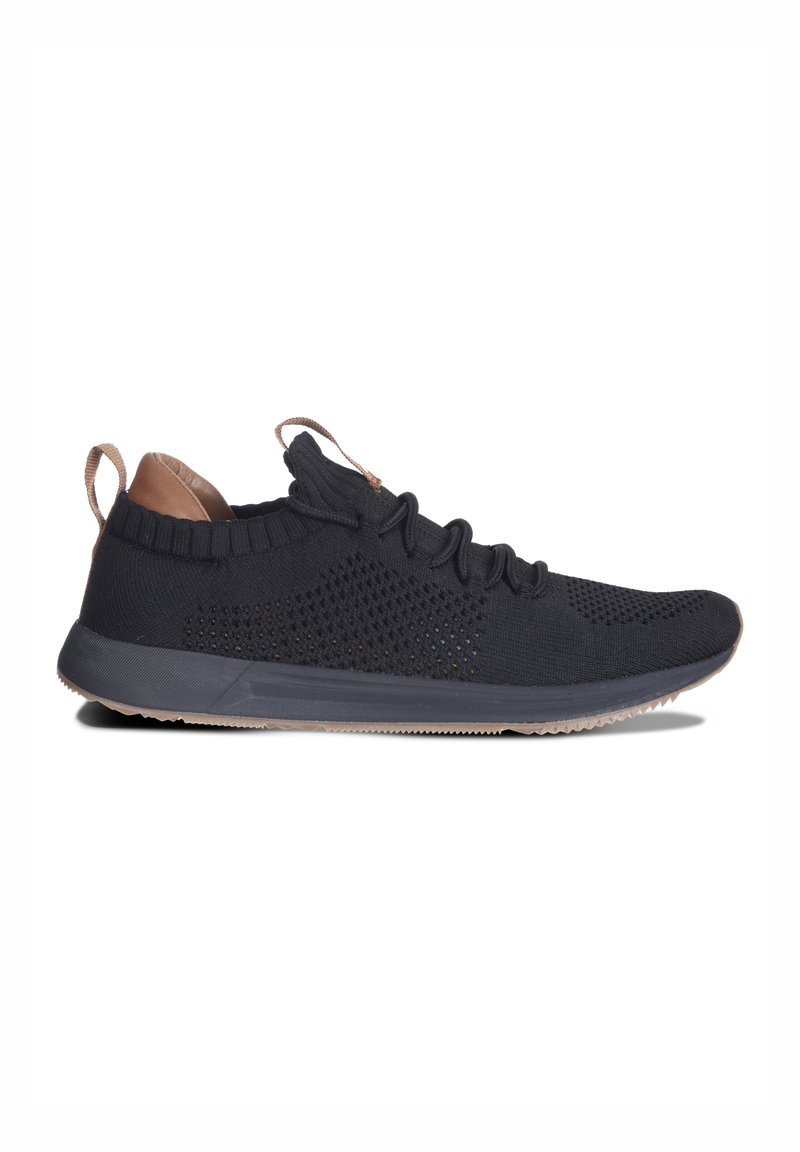 Black knit sneaker with a textured upper, light brown accents and laces, and a flexible rubber sole. Features a sock-like collar.