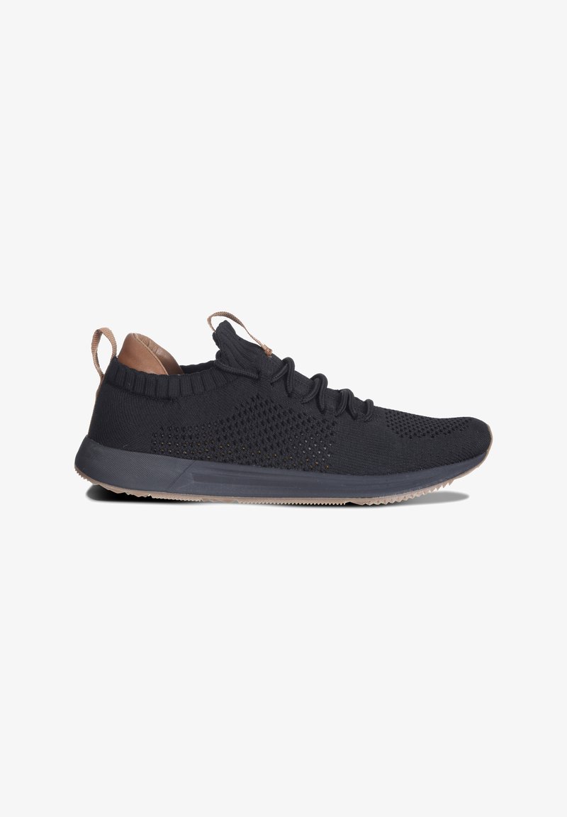 Black knit sneaker with a textured upper, light brown accents and laces, and a flexible rubber sole. Features a sock-like collar.