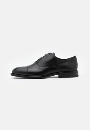 LATHAN - Lace-ups - black