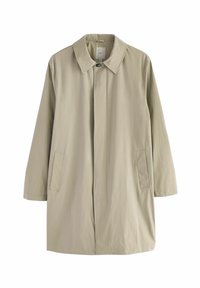 Lichtbeige, lange jas gemaakt van gladde stof met een kraag, knoopsluiting aan de voorkant en twee zijzakken. Minimalistisch ontwerp en rechte snit.