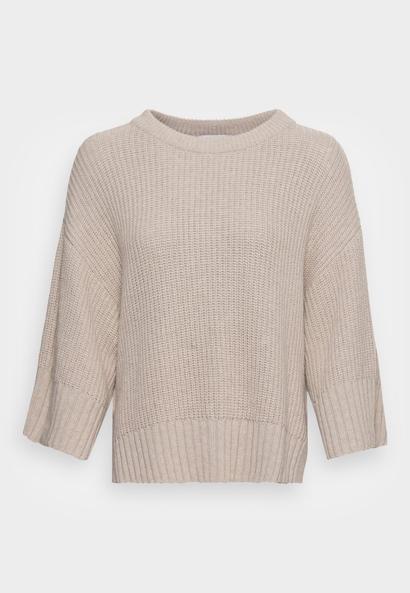 Pull beige tricoté avec une surface texturée, manches larges trois-quarts et détail de bas en côte. Tissu doux et léger.