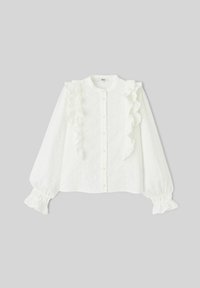 Chemise blanche à manches longues avec accents volantés et fermeture à boutons. Présente un tissu texturé brodé et des poignets élastiqués.