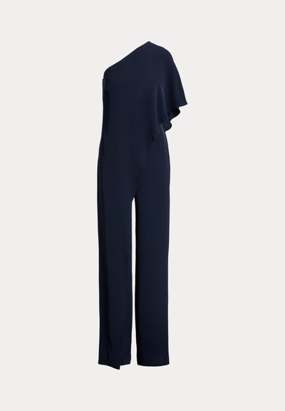 Jumpsuit navy à une épaule avec un volant drapé sur un côté, coupe ajustée avec jambes larges, confectionné en tissu lisse et léger.